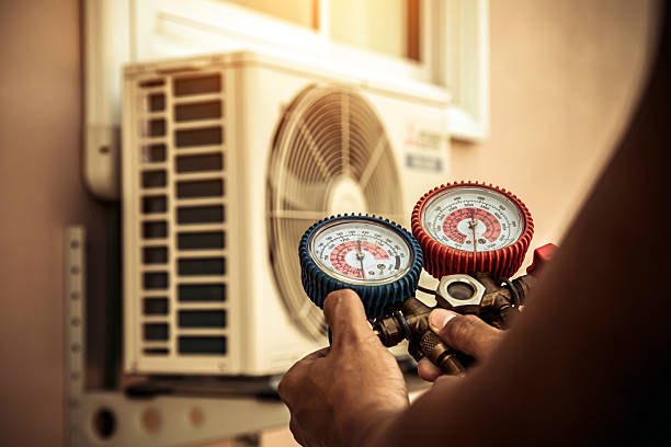 Professional Air Conditioning Service technician working in Florence, MT